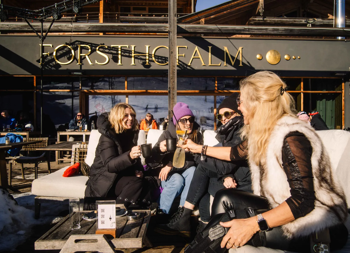 People enjoying drinks on the terrace of Forsthichalm.